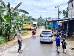Polsek Haruai Pantau Debit Sungai Marindi, Akses Warga Tetap Aman Pasca hujan Lebat